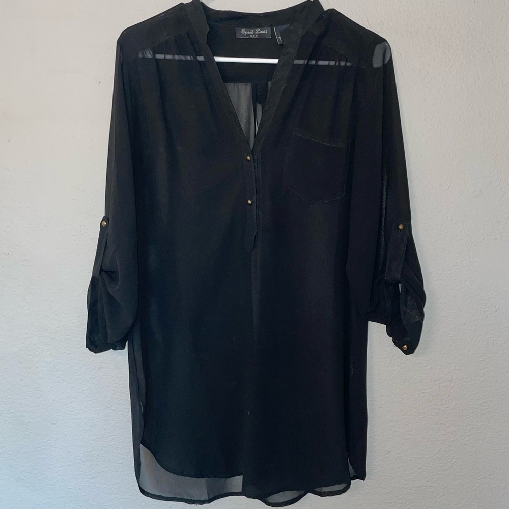 Black blouse with brass buttons